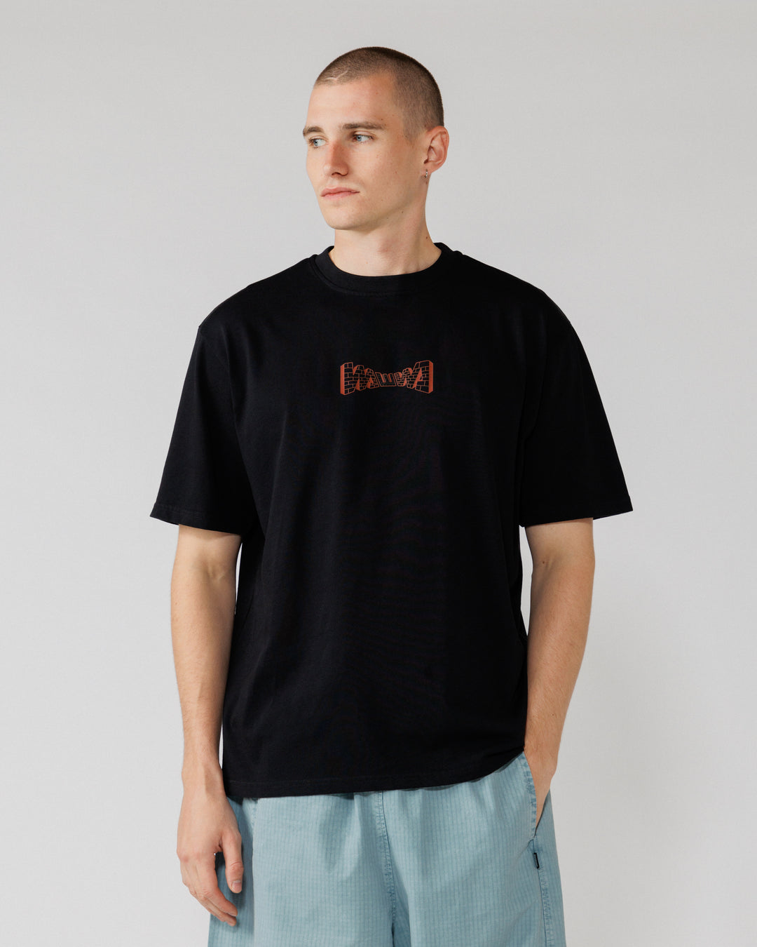 Brick Logo T-Shirt - Black — front crop, red graphic legible
