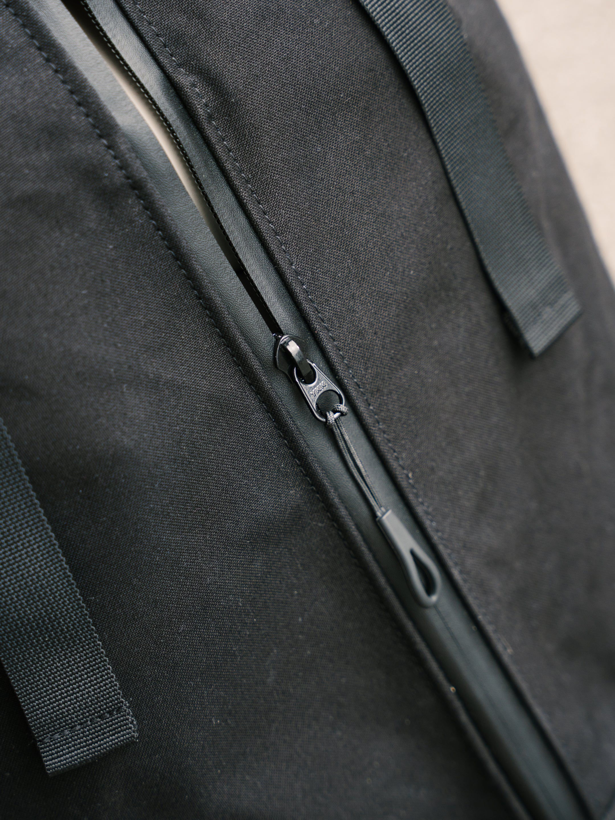 Waterproof zip detail on the Bridge Backpack in Black