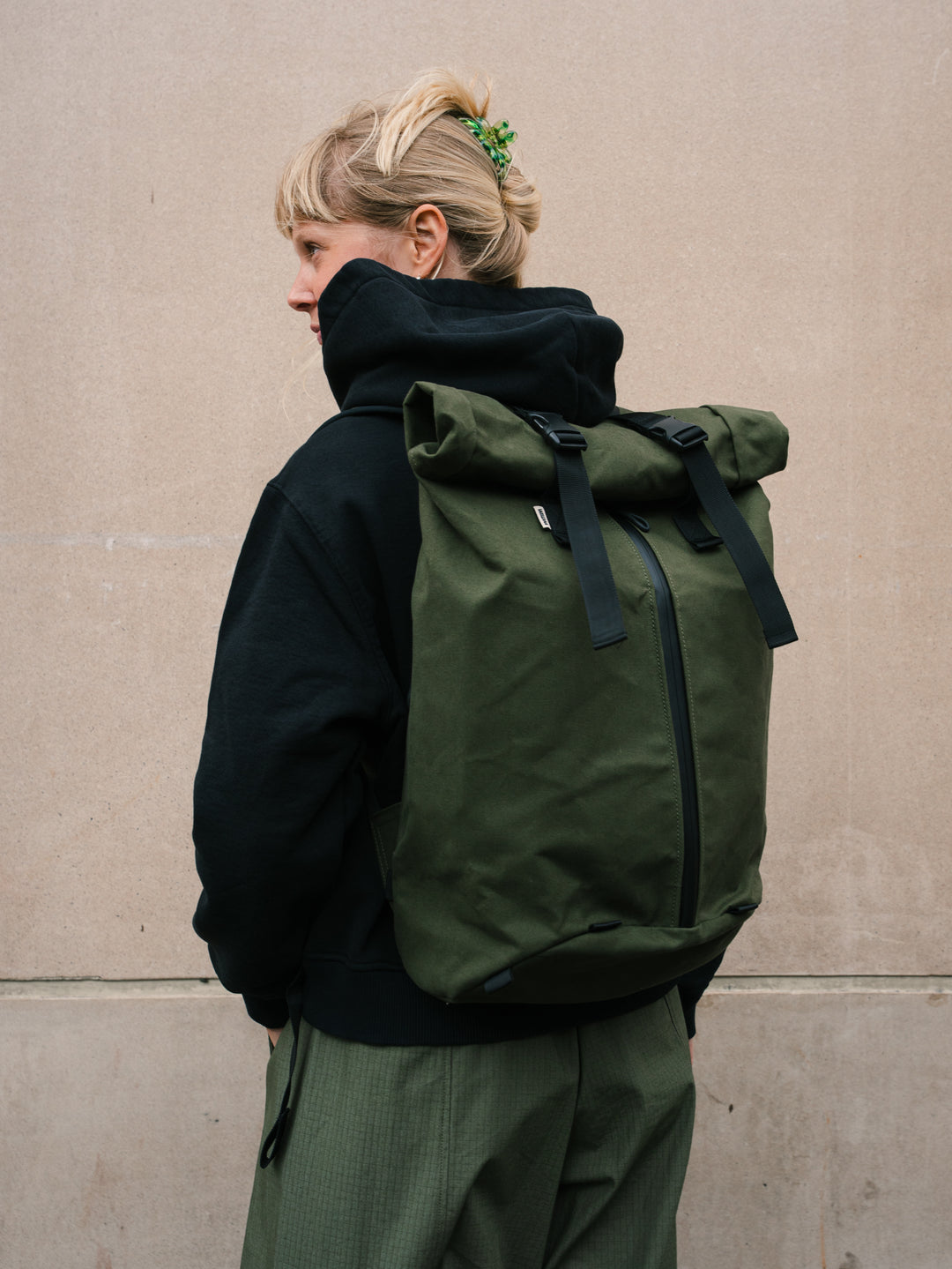 Bridge Backpack in Khaki Green worn on model, back view