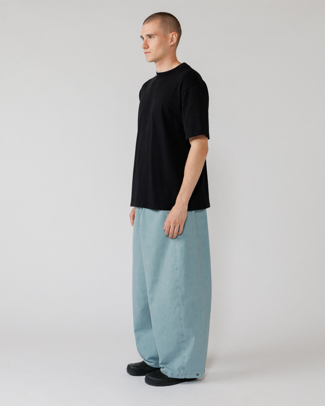 Garment Dyed Atlas Pants - Powder Blue — 3/4 angle shows volume