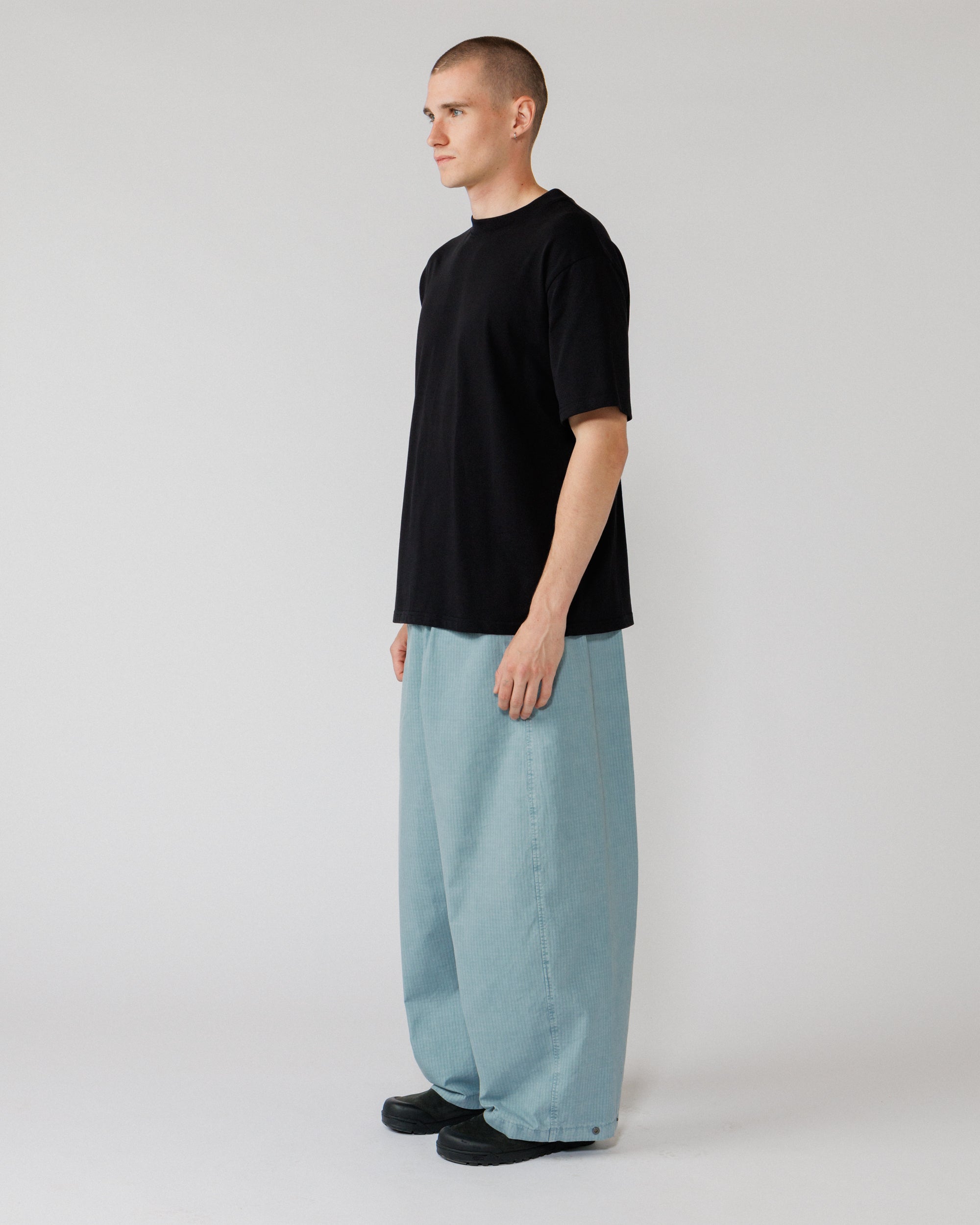 Garment Dyed Atlas Pants - Powder Blue — 3/4 angle shows volume