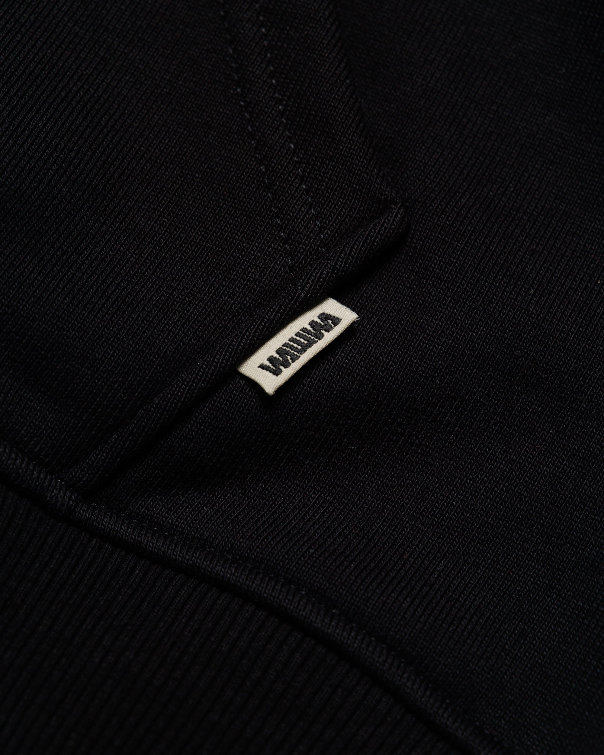 Heavyweight Two-Way Zip Hoody - Black — Hem label branding detail