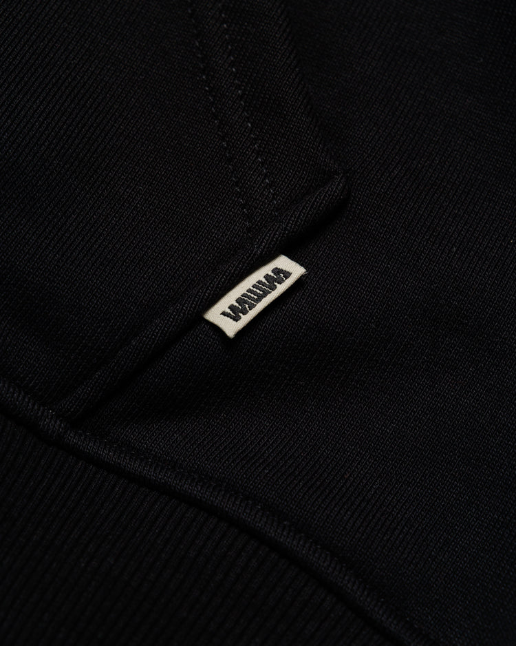 Heavyweight Two-Way Zip Hoody - Black — Hem label branding detail