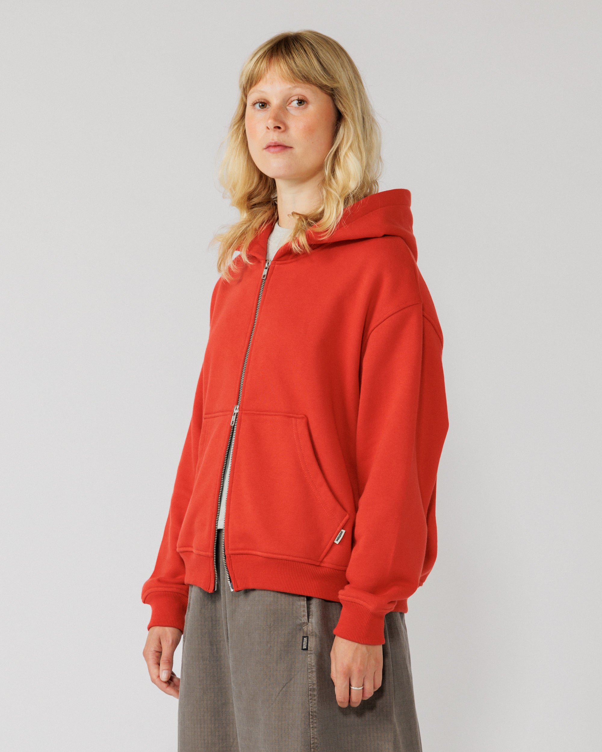 Heavyweight Two-Way Zip Hoody - Signal Red — Female side angle, drape clear