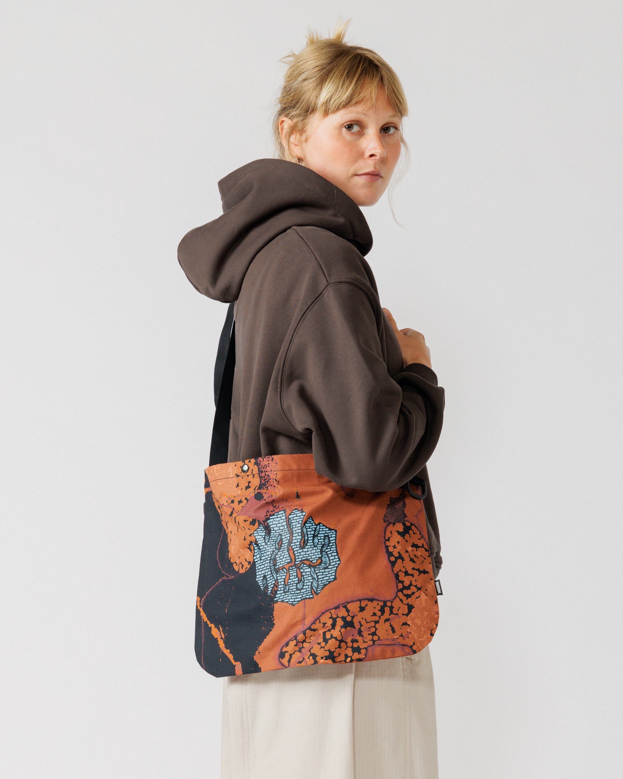 Musette - Abstract Brick Camo — side view, drape and scale