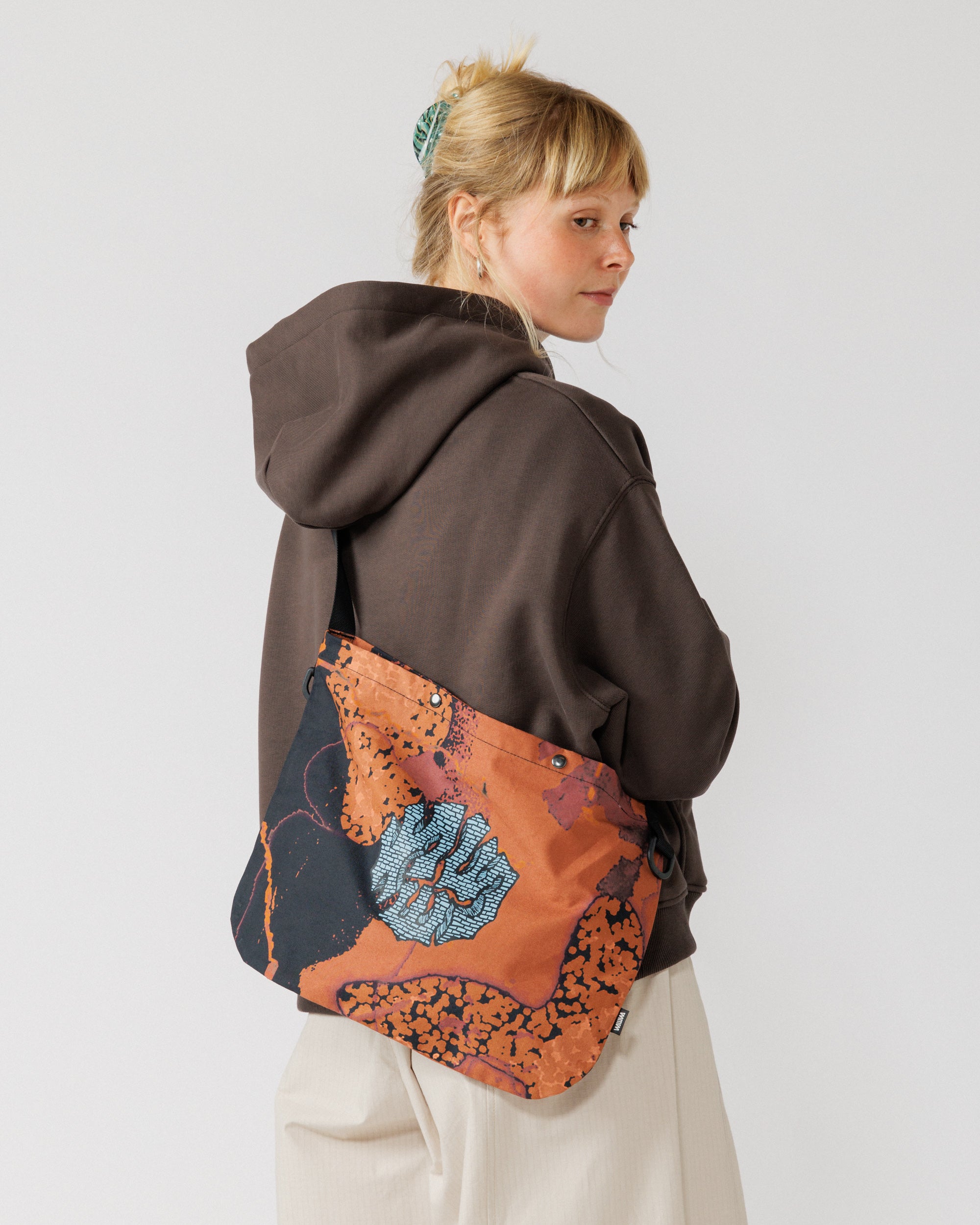Musette - Abstract Brick Camo — back view, worn behind