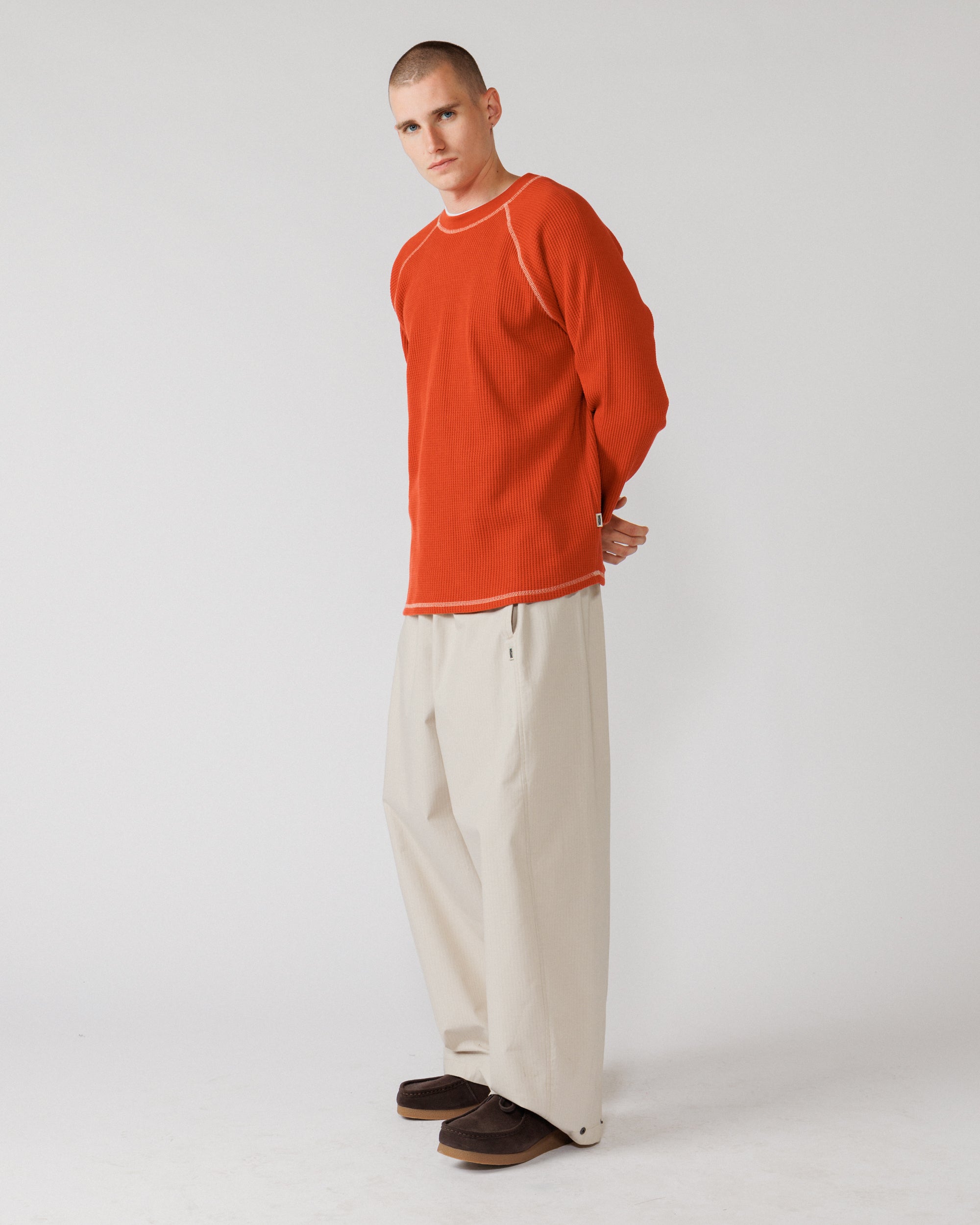 Raglan Range Waffle Knit - Signal Red w Ecru — side profile, sleeve shape