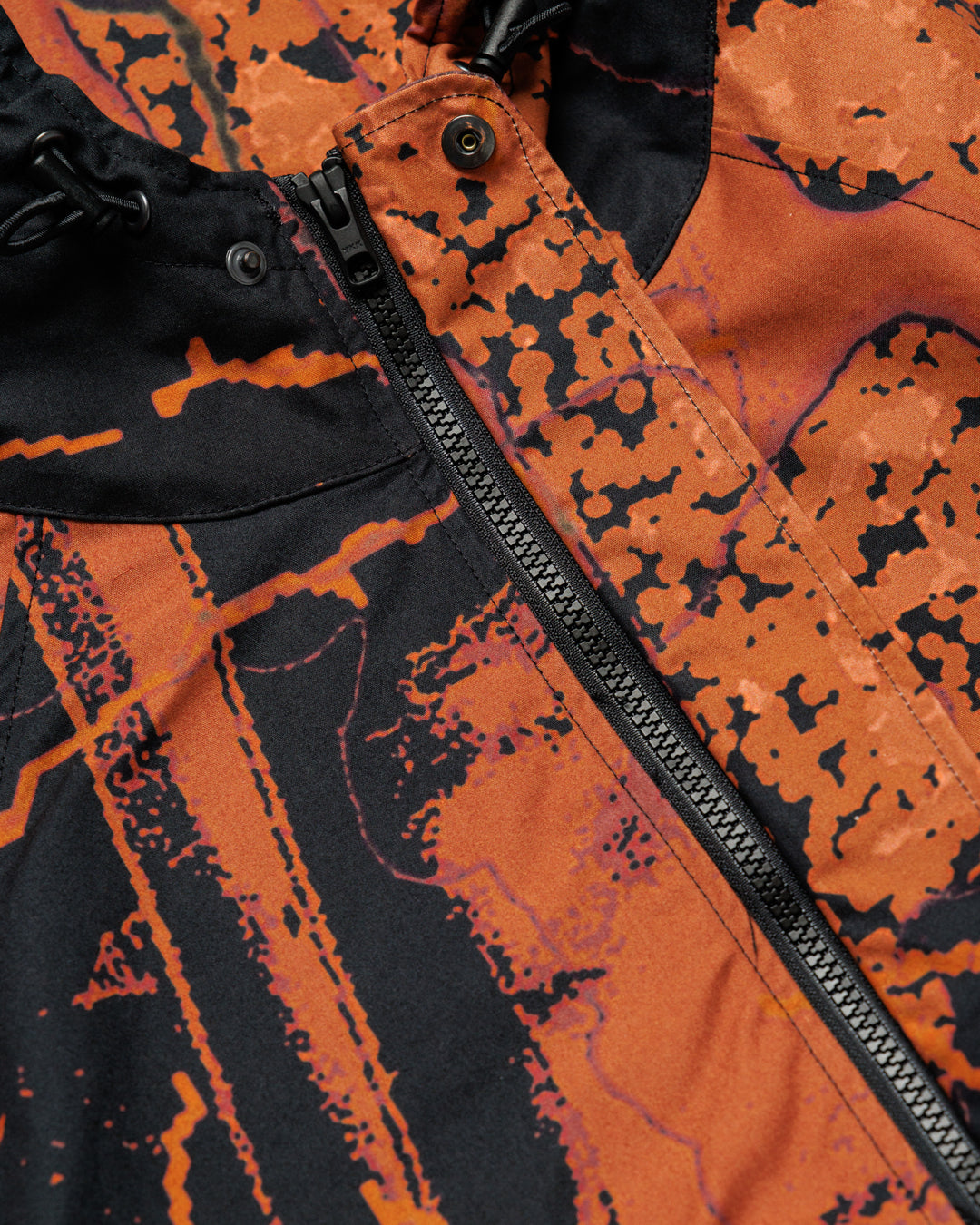Roam Raglan Jacket - Abstract Brick Camo — zip, snap, hood toggles detail