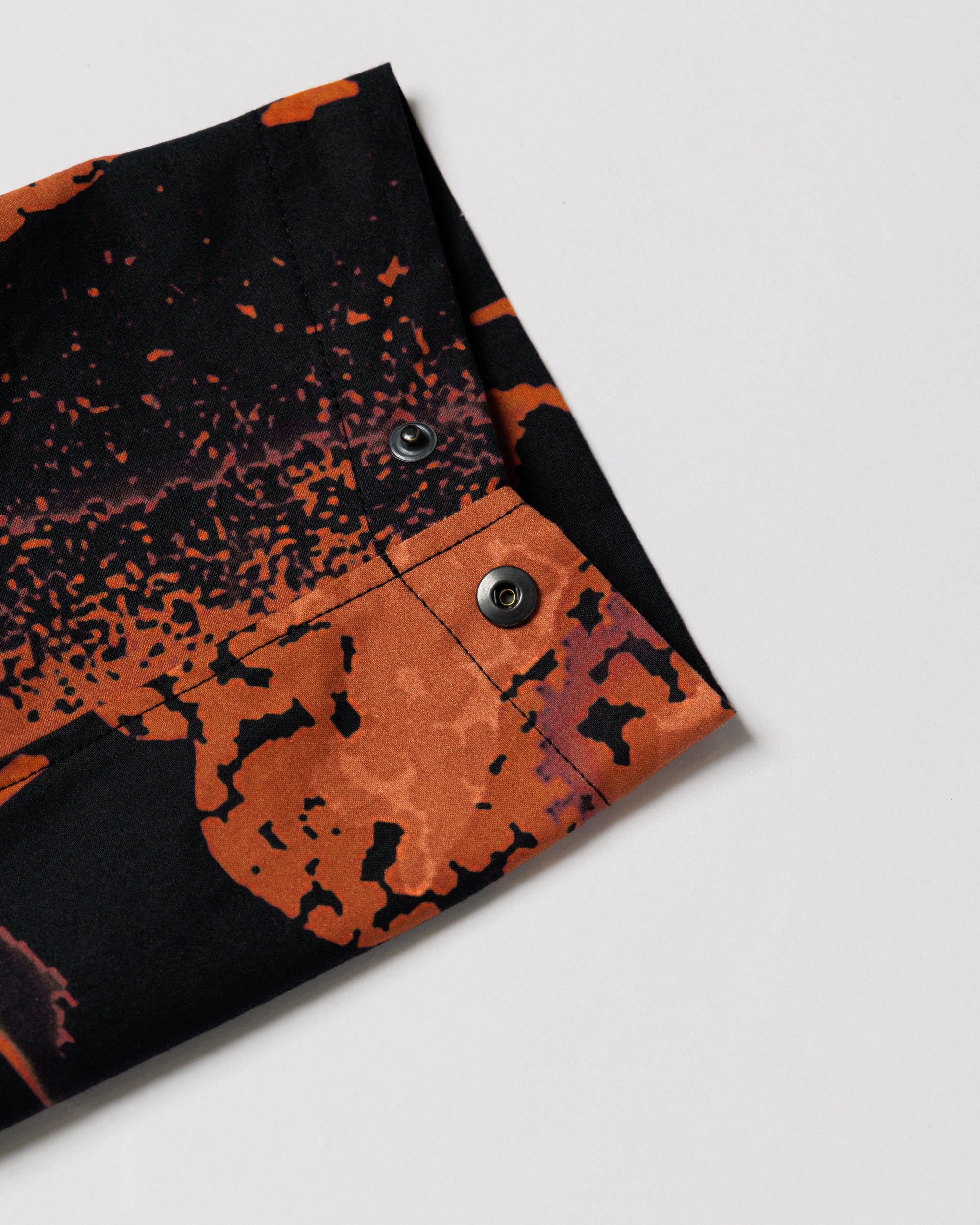 Roam Raglan Jacket - Abstract Brick Camo — cuff snap closure flat