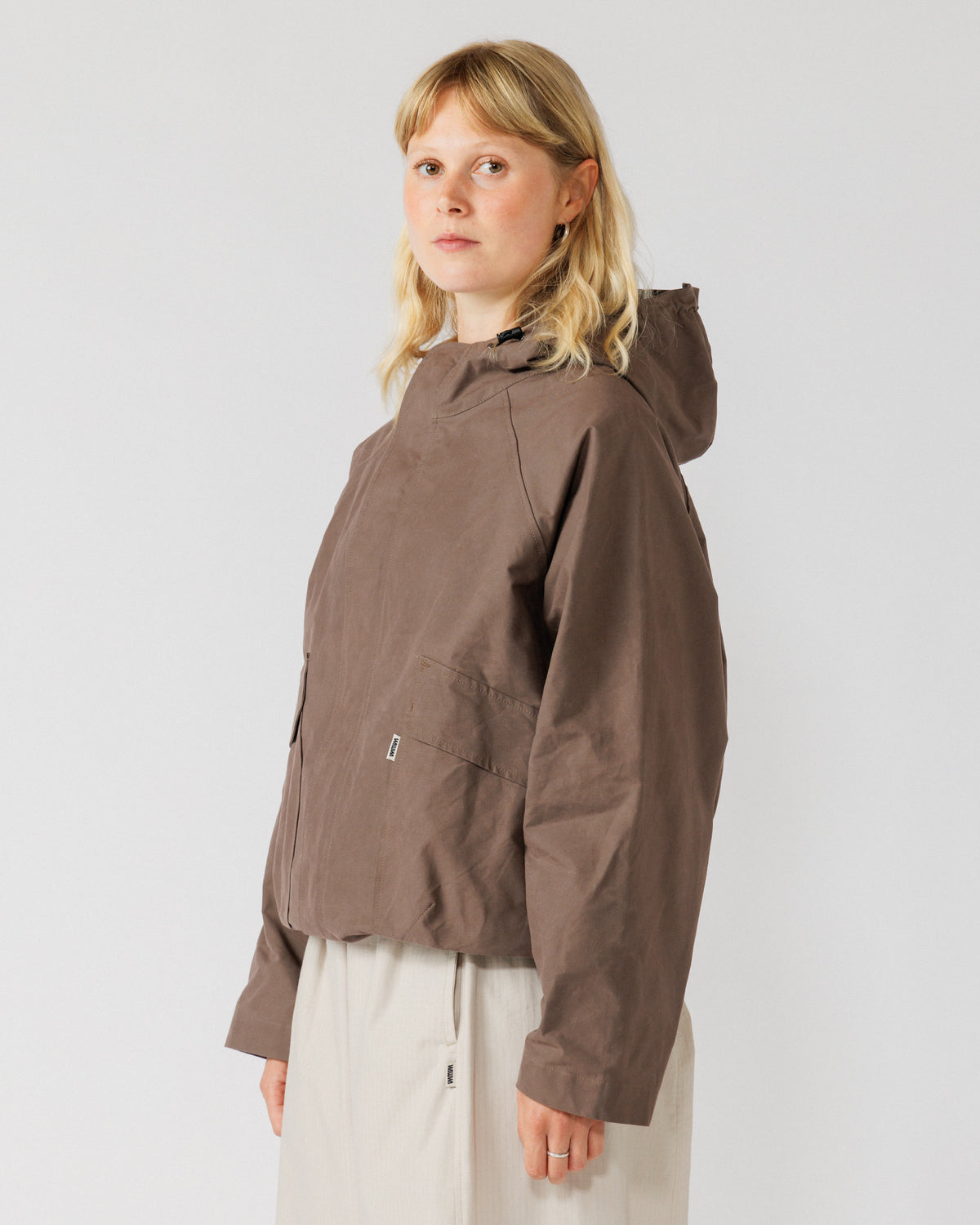 Roam Raglan Jacket - Bracken — female three-quarter angle, adds variety