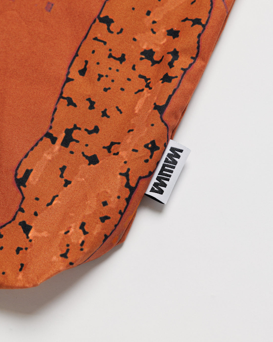 Water Resistant Messenger Bag - Abstract Brick Camo — print and label close-up