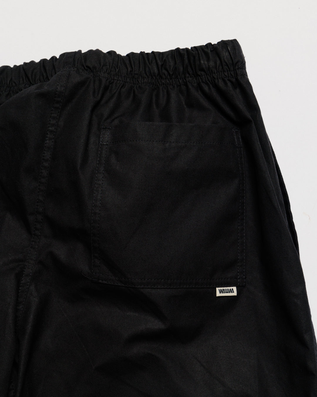 Water Resistant Zama Pants - Black — back pocket label detail